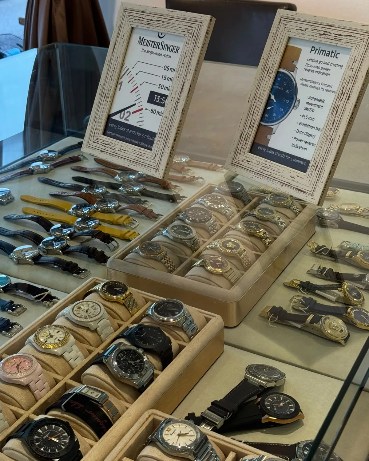Trays of watches out on the table in the showroom